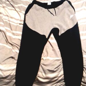 Nike tech Fleece joggers color is black and gray and size medium